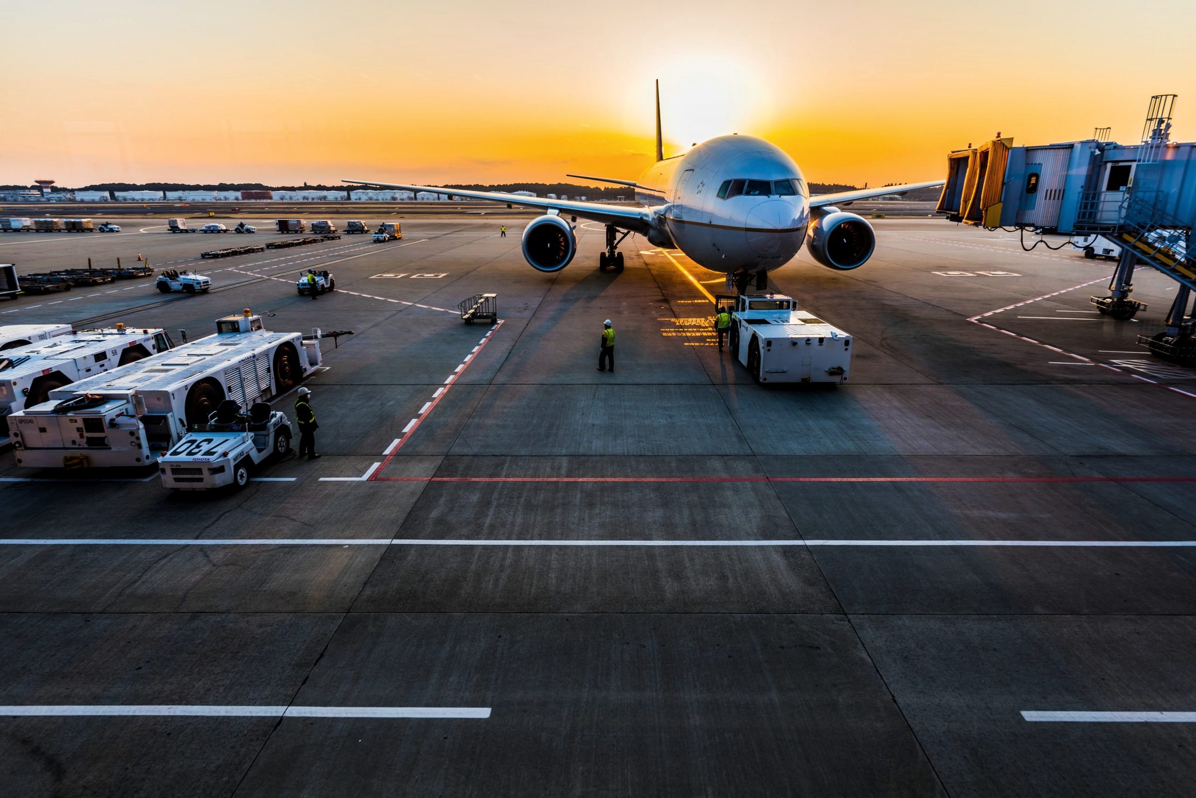 An aircraft on stand at the terminal at first light